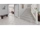 Welcoming entryway with tiled floors, staircase, and convenient bench seating at 21 Ocean Harbour Ln, Las Vegas, NV 89148