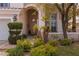 Inviting front entrance with stone walkway and mature landscaping for added curb appeal at 21 Ocean Harbour Ln, Las Vegas, NV 89148