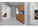 Hallway featuring custom built-in cabinets and easy access to bedrooms and living spaces at 21 Ocean Harbour Ln, Las Vegas, NV 89148