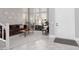 Bright living room with soaring windows, neutral decor, and stylish tile flooring at 21 Ocean Harbour Ln, Las Vegas, NV 89148