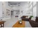 Spacious living room featuring high ceilings, staircase, and comfortable seating at 21 Ocean Harbour Ln, Las Vegas, NV 89148