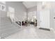 Open-concept living area featuring high ceilings, staircase, and an abundance of natural light at 21 Ocean Harbour Ln, Las Vegas, NV 89148