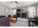 Spacious living room with a fireplace, television, ceiling fan, comfortable couches and light walls at 21 Ocean Harbour Ln, Las Vegas, NV 89148