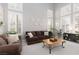 Comfortable living room boasts a plush sofa, large windows, and inviting decor at 21 Ocean Harbour Ln, Las Vegas, NV 89148