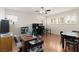 Bright home office featuring hardwood floors, multiple windows, and ample workspace at 21 Ocean Harbour Ln, Las Vegas, NV 89148