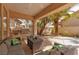 Charming outdoor kitchen and patio with comfortable seating and lush landscaping at 21 Ocean Harbour Ln, Las Vegas, NV 89148