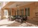 Cozy covered patio featuring comfortable seating with cushions, perfect for outdoor relaxation and entertaining at 21 Ocean Harbour Ln, Las Vegas, NV 89148
