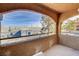 Covered balcony with textured stucco and wrought iron railings offers outdoor views at 220 Mission Catalina Ln # 207, Las Vegas, NV 89107