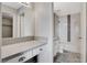Well-lit bathroom featuring a vanity, and a shower-tub combination with tiled walls at 220 Mission Catalina Ln # 207, Las Vegas, NV 89107