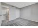Bedroom featuring gray carpeting, neutral walls, and easy bathroom access at 220 Mission Catalina Ln # 207, Las Vegas, NV 89107