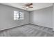 Bright bedroom with a ceiling fan and a large window at 220 Mission Catalina Ln # 207, Las Vegas, NV 89107