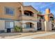 Condo building exterior featuring private balconies and convenient stairwell access at 220 Mission Catalina Ln # 207, Las Vegas, NV 89107
