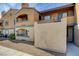 Condo building featuring stucco facade, private balconies, and desert landscaping at 220 Mission Catalina Ln # 207, Las Vegas, NV 89107