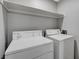 Enclosed laundry room featuring a top-load washer and top-load dryer in a closet at 220 Mission Catalina Ln # 207, Las Vegas, NV 89107