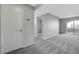 Spacious living room with neutral gray carpet and a sliding glass door to the balcony at 220 Mission Catalina Ln # 207, Las Vegas, NV 89107