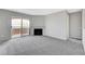 Spacious living room with fireplace and sliding doors opening to private patio at 220 Mission Catalina Ln # 207, Las Vegas, NV 89107