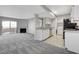 Open concept living room flows into kitchen, offering seamless entertaining space at 220 Mission Catalina Ln # 207, Las Vegas, NV 89107