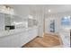 Light-filled bathroom with double vanity, tile floors, and walk-in shower at 2221 Loggerhead Rd, Las Vegas, NV 89117