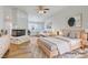 Bright, virtually staged bedroom featuring a fireplace and an open layout at 2221 Loggerhead Rd, Las Vegas, NV 89117