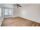 Well-lit bedroom showcases wood floors and a bright, inviting atmosphere at 2221 Loggerhead Rd, Las Vegas, NV 89117