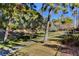 Landscaped community featuring mature trees and well-maintained walking paths at 2221 Loggerhead Rd, Las Vegas, NV 89117