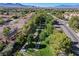 Picturesque aerial shot of a neighborhood with tree-lined streets and landscaping at 2221 Loggerhead Rd, Las Vegas, NV 89117