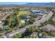Aerial view of the community featuring a lush park, tennis courts, and landscaping at 2221 Loggerhead Rd, Las Vegas, NV 89117