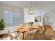 Dining area with modern lighting, ample seating, and stylish decor in a well-lit space at 2221 Loggerhead Rd, Las Vegas, NV 89117