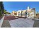 Attractive home featuring a covered patio and desert landscaping, creating a welcoming outdoor space at 2221 Loggerhead Rd, Las Vegas, NV 89117