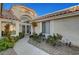 Front entrance with double decorative doors and desert landscaping create inviting curb appeal for this residence at 2221 Loggerhead Rd, Las Vegas, NV 89117