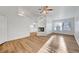 Open-concept living room boasts hardwood floors, neutral walls, and a cozy fireplace at 2221 Loggerhead Rd, Las Vegas, NV 89117