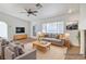 Virtually staged room with fireplace, furniture, and natural light at 2221 Loggerhead Rd, Las Vegas, NV 89117