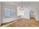 Bright living space with hardwood floors and view to kitchen area featuring modern stainless steel appliances at 2221 Loggerhead Rd, Las Vegas, NV 89117