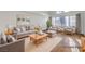 Bright, virtually staged living room with neutral tones and ample natural light at 2221 Loggerhead Rd, Las Vegas, NV 89117