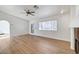 Room with fireplace, wood flooring, windows and exterior door at 2221 Loggerhead Rd, Las Vegas, NV 89117