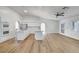 Open-concept kitchen and living space with light-filled windows at 2221 Loggerhead Rd, Las Vegas, NV 89117