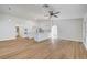 Open-concept kitchen and living space with wood floors and natural light at 2221 Loggerhead Rd, Las Vegas, NV 89117