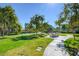 Shaded picnic area with tables and lush green surroundings, perfect for outdoor gatherings and relaxation at 2221 Loggerhead Rd, Las Vegas, NV 89117