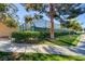 Community tennis court and sidewalks surrounded by verdant landscaping, perfect for an active lifestyle at 2221 Loggerhead Rd, Las Vegas, NV 89117