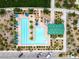 Elevated aerial shot of a community swimming pool, complete with lounge areas and architectural pool house structure at 2376 Via Firenze, Henderson, NV 89044