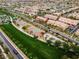 Birds-eye view of a neighborhood park with multiple sports courts, integrated within a residential community layout at 2376 Via Firenze, Henderson, NV 89044