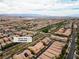 An aerial view of a neighborhood featuring desert landscaping and mountain views at 2376 Via Firenze, Henderson, NV 89044
