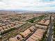 An aerial view of a neighborhood featuring desert landscaping and mountain views at 2376 Via Firenze, Henderson, NV 89044