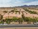An aerial view showing a neighborhood, landscaping, and mountain views at 2376 Via Firenze, Henderson, NV 89044