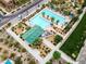 Community pool area showing a large swimming pool, seating, and a recreation building from an aerial viewpoint at 2376 Via Firenze, Henderson, NV 89044
