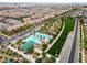 Aerial perspective of a community swimming pool surrounded by landscaping and community amenities at 2376 Via Firenze, Henderson, NV 89044