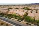 An aerial view of a neighborhood featuring mature landscaping and street parking at 2376 Via Firenze, Henderson, NV 89044