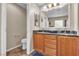 Bathroom featuring a spacious dual sink vanity and separate toilet room at 2376 Via Firenze, Henderson, NV 89044