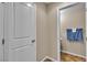 Clean half bathroom with a white door, beige walls, and attractive tile flooring at 2376 Via Firenze, Henderson, NV 89044