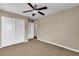 Cozy bedroom with a ceiling fan and a closet providing ample storage space at 2376 Via Firenze, Henderson, NV 89044